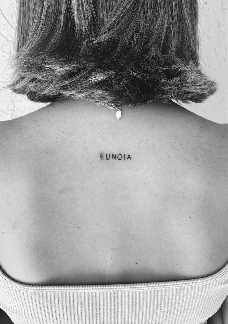 #onewordtattoo Dainty One Word Tattoo, Tiny Words Tattoo Placement, Names On Back Tattoo, Release Tattoo Words, Small Word Back Tattoos, One Word Tattoos Meaningful French, Upper Back Script Tattoo, Word On Back Tattoo, Back Next Tattoo