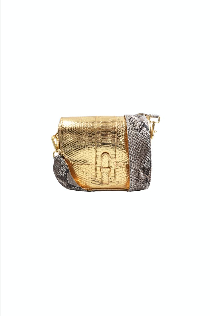 This one-of-a-kind bag fits everything comes with hooks to attach an optional strap. Detailed with a concealed magnetic closure, interior slip pocket, and fully lined. Made in Italy from responsibly sourced Python. Color: Metallic Gold Composition: Python Width: 8.8"Height: 7.7"Depth: 3" *A portion of the proceeds of the sale of this bag will benefit the Fish & Wildlife Foundation of Florida. "The Kara bag is one of my favorite everyday bags. With a modern twist on my traditional python strap, this unconventional style adds an edge to any casual outfit." XK Luxury Square Travel Bag, High-end Mobile Phone Pouch Bag, High-end Travel Pouch Flap Bag, Luxury Square Shoulder Bag For On-the-go, High-end Rectangular Flap Bag For Travel, Luxury Crossbody Shoulder Bag With Removable Pouch, High-end Travel Clutch Satchel, Luxury Rectangular Shoulder Bag With Removable Pouch, Luxury Pouch Box Bag For Daily Use