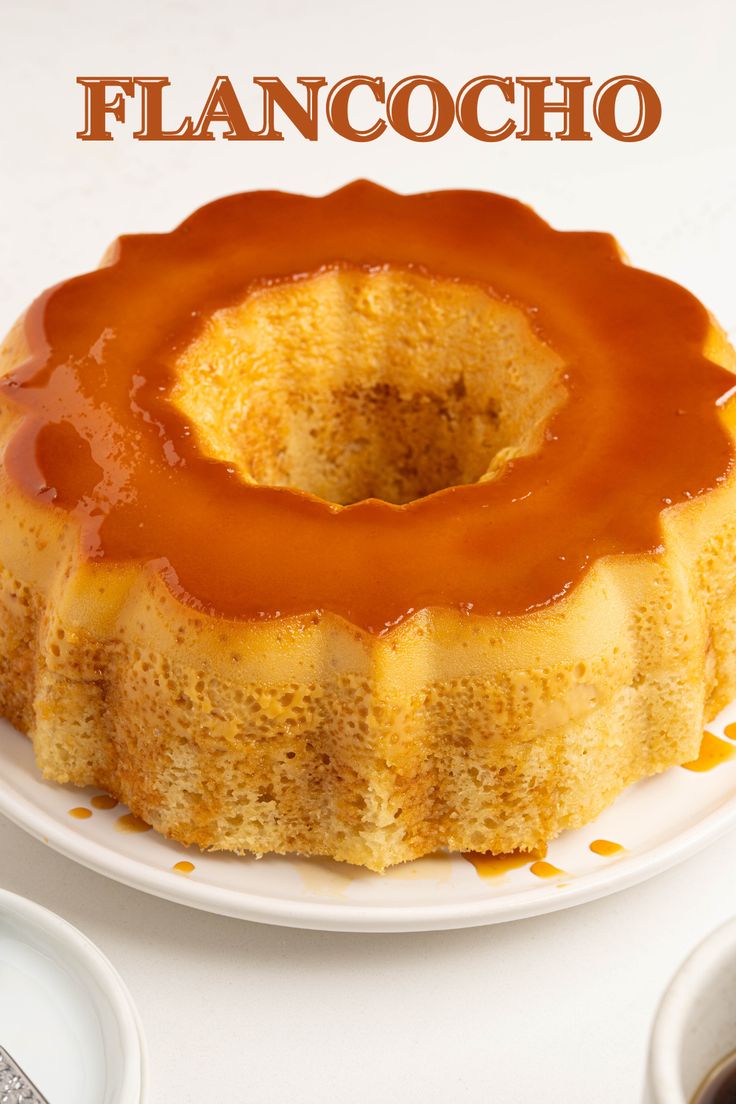 a bundt cake with caramel sauce on top and the words flancocho above it