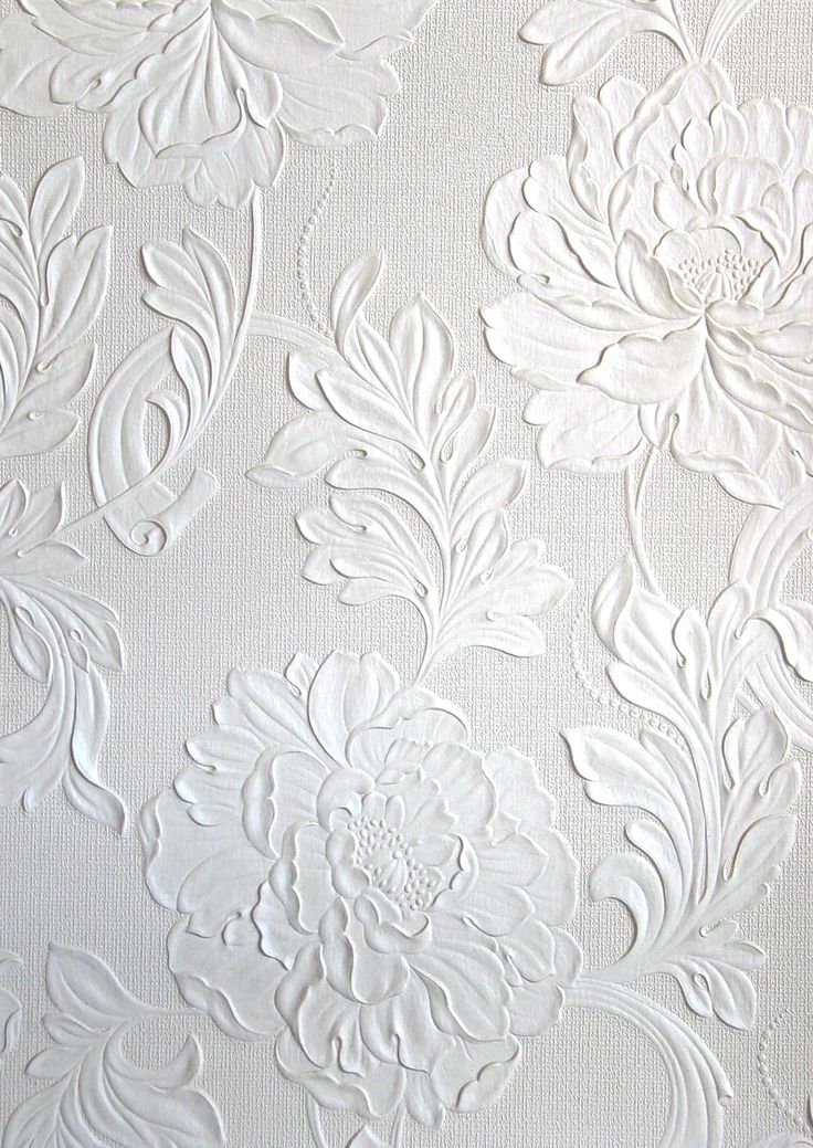 white floral wallpaper with large flowers on it