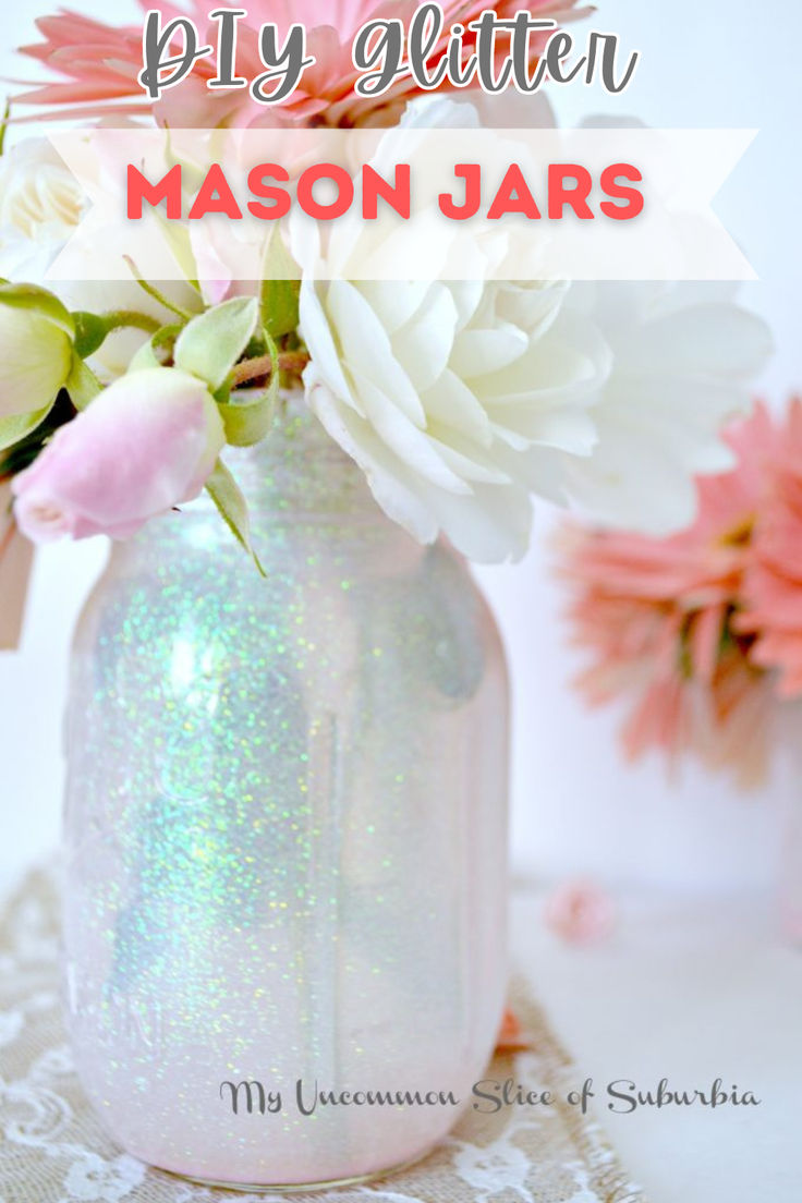 a vase filled with white and pink flowers on top of a lace covered table cloth