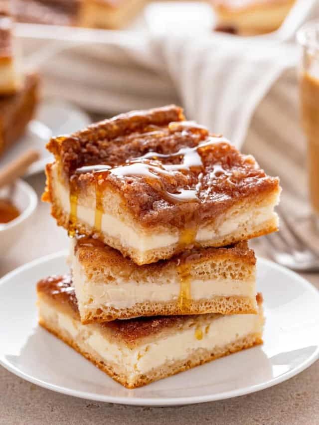 three pieces of cake sitting on top of a white plate