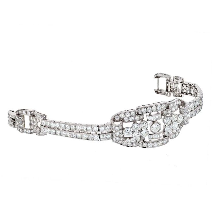 For Sale on 1stDibs - This particular piece is a perfect example of Art Deco craftsmanship and elegance! The bracelet is designed in platinum as an openwork panel that graduates Art Deco Platinum Diamond Bracelet, Art Deco White Gold Diamond Bracelet With Brilliant Cut, Art Deco Diamond Bracelets For Anniversary, Vintage White Gold Diamond Bracelet With Brilliant Cut, Exquisite Platinum Diamond Bracelet With Brilliant Cut, Luxury Platinum Diamond Bracelet With Accents, Luxury Platinum Diamond Bracelet With Diamond Accents, Elegant Platinum Diamond Bracelet With Prong Setting, Art Deco Diamond Jubilee Bracelet