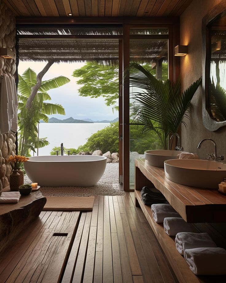 a bath room with a tub a sink and two sinks inside of it on a wooden floor