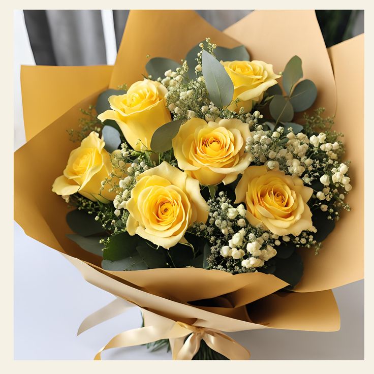 a bouquet of yellow roses with baby's breath