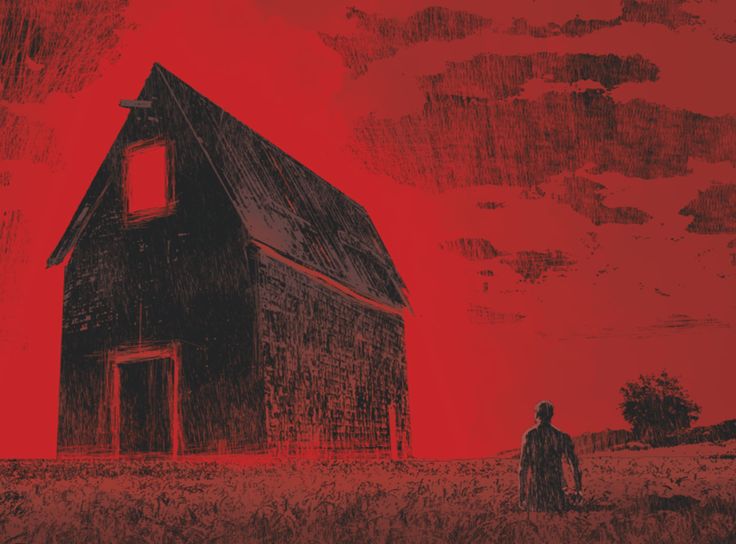 a man standing in front of a red sky next to a black and white barn