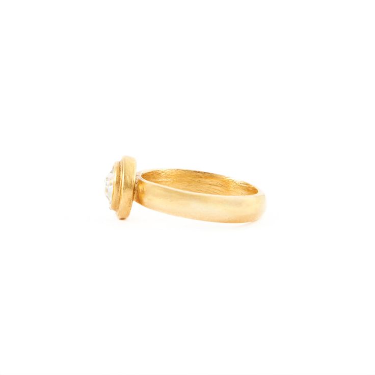 The Albertine Ring from Laurine's Voyage Collection is a work of art. It's handmade in New York City from the finest materials. The ring is crafted from a tin alloy and electroplated with 24kt gold. The center stone is a genuine clear-cut crystal and this ring can be made in size 6, 7, or 8. Please specify sizing in order notes. The ring is made to order in our York City Design Studio. Please allow 7-14 business days for production before the ship date. Gold Dome Ring With Bezel Setting Diamond, Gold Dome Ring With Bezel Setting For Anniversary, Gold Ring With Bezel Setting, Timeless Gold Topaz Round Ring, Heirloom Gold Topaz Ring With Center Stone, Timeless Gold Diamond Ring With Round Stone, Gold Crystal Ring With Single Diamond - Fine Jewelry, Elegant Gold Crystal Ring With Single Diamond, Gold Ring With Single Round Diamond