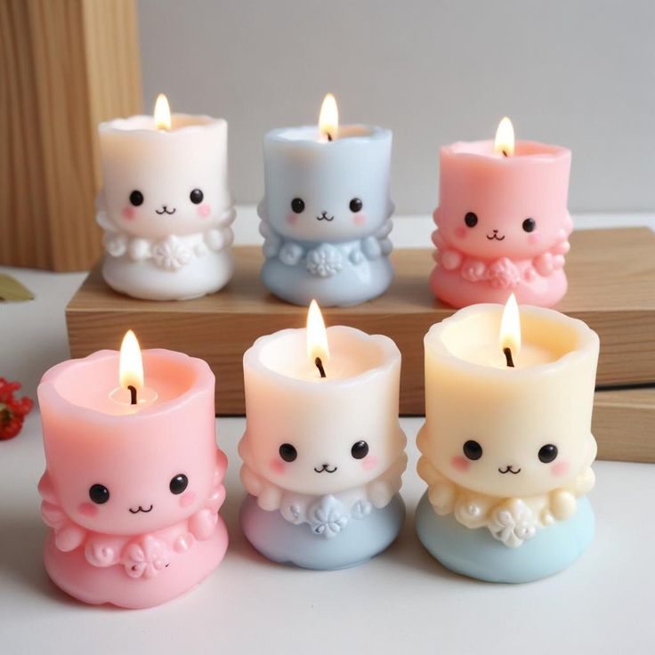 small candles in the shape of animals with faces on them