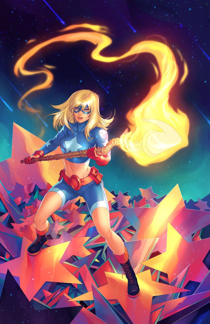 a woman in blue and red outfit holding a fire stick on top of a mountain