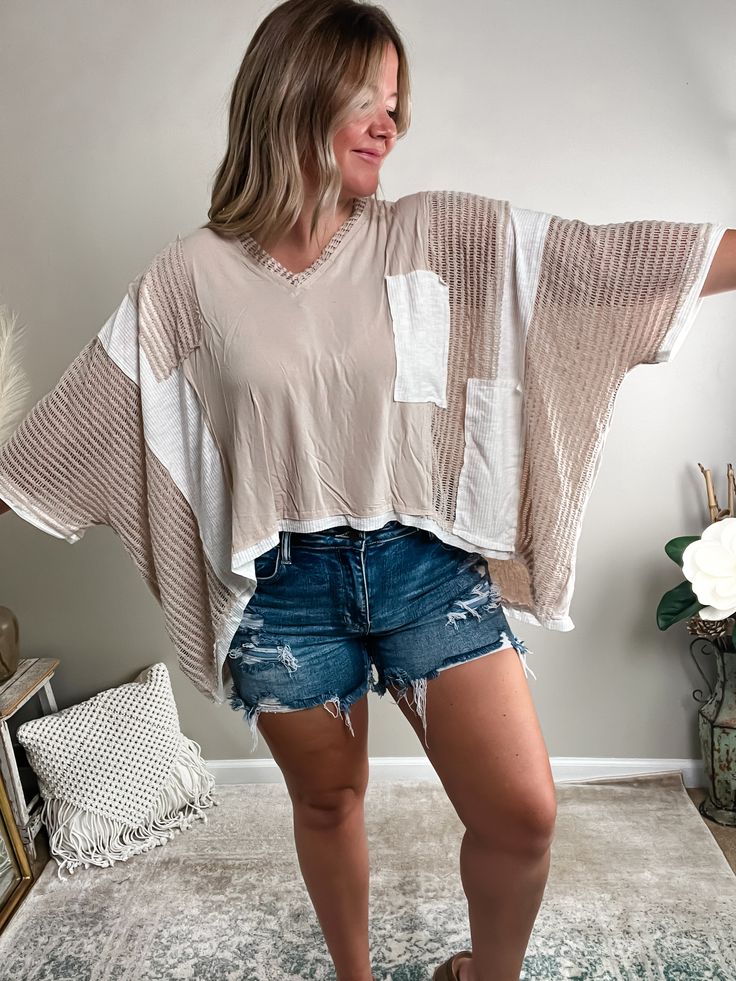 It's the care-free look you've been searching for! Made of a lightweight material and contrast details, this top is made with our texture-loving queens in mind! Get ready for playful patchwork, monochromatic colorways, ribbing, and crochet elements - this piece is truly one-of-a-kind! Fits oversized; Bethany is 5'4" 175lb and wearing a medium.AVAILABLE IN MORE COLORS!Pair it with one of our Basic Tanks or bramis!Complete the look with our Alaina Denim Shorts, Blowout Platform Sandals. and Rhinestone Cross Necklace. Material: Self - 94% Rayon 6% SpandexContrast - 60% Polyester 30% Rayon 10% Spandex Beige Patchwork Tops For Summer, Beige Cotton Blouse With Patchwork, Casual Textured Tops For Layering, White Patchwork Tops For Layering, Casual Beige Patchwork Tops, Textured Cotton Tops For Spring, Textured Top For Spring Layering, Cream Long Sleeve Top With Patchwork, Cream Cotton Tops For Layering