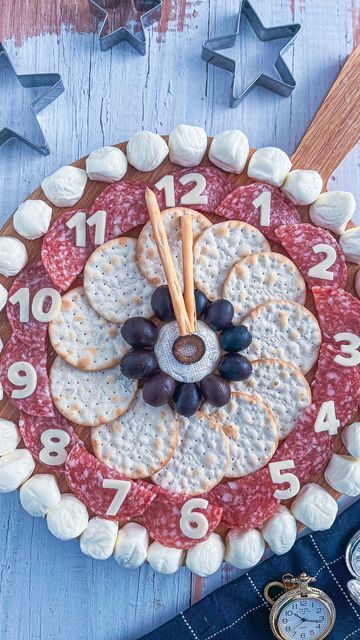 a clock made out of crackers and cheese