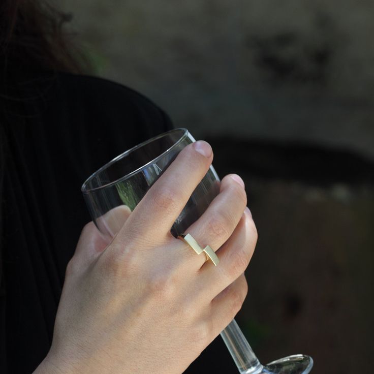 This is a unique geometric 14k solid gold ring. The ring is handmade of yellow 14k solid gold, and its finish is smooth and shiny. The rectangles have a delicate scratched finish. The meeting point of the rectangles, at one corner, reminds me of a kiss. A minimalist, modern, and eye catching ring. Ring's size is 6 1/4 Rectangle's width is approx. 4 mm = 0.15 inch each Rectangle's length is approx. 11.5 mm = 0.45 inch each * The ring will be packed in a gift box ready to give as a gift, and shipp Modern Recycled Gold Stackable Rings Gift, Modern Gold Signet Ring With Tension Setting, Minimalist White Gold Initial Ring For Formal Occasions, Modern Gold Stackable Rings With Tension Setting, Modern Yellow Gold Stackable Rings In Recycled Gold, Modern Midi Rings In Recycled Gold As Gift, Modern Stackable Rings In Recycled Gold With Polished Finish, Modern Recycled Gold Midi Rings As Gift, Modern Recycled Gold Midi Rings Gift