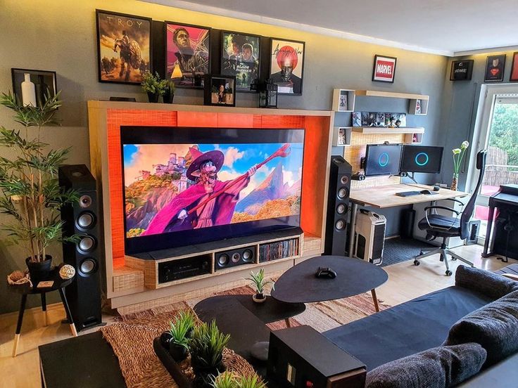 a living room filled with furniture and a large flat screen tv mounted to the wall