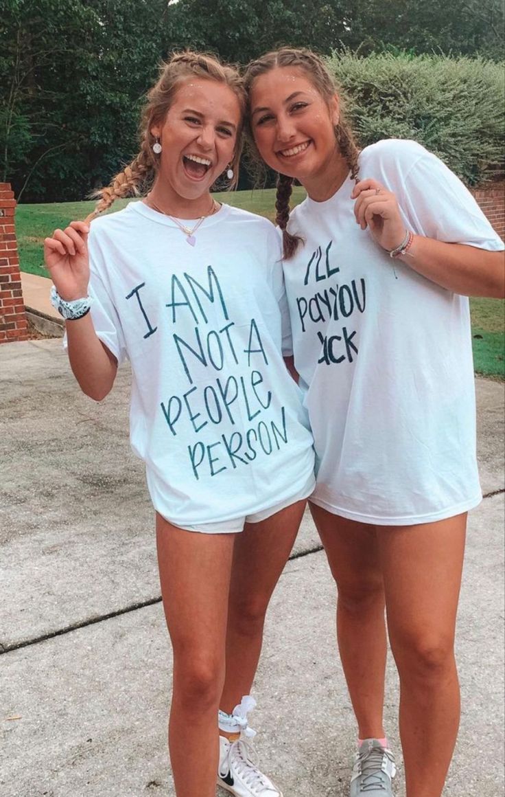 two girls standing next to each other wearing t - shirts that say i am not a people person