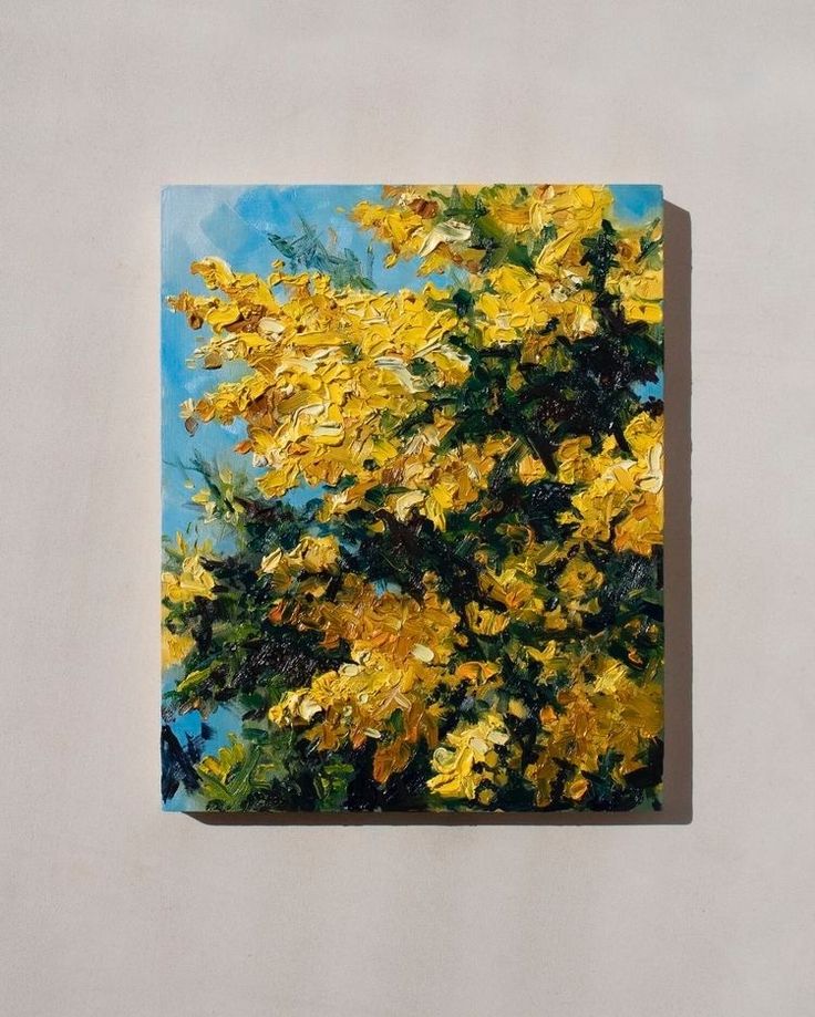 a painting of yellow flowers on a white wall with blue sky in the back ground