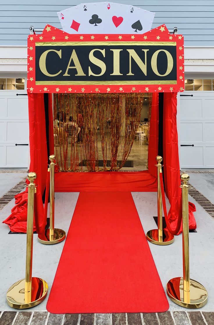 a red carpeted entrance to a casino booth