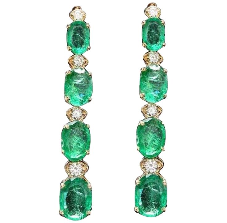 Exquisite 7.30 Carats Natural Emerald and Diamond 14K Solid Yellow Gold Earrings Amazing looking piece! Suggested Replacement Value Approx. $6,000.00 Total Natural Round Cut White Diamonds Weight: Approx. 0.30 Carats (color G-H / Clarity SI1-SI2) Total Natural Oval Cut Emeralds Weight: Approx. 7.00 Carats Emerald Measures: Approx. 8 x 6 (6x4)mm Emerald Treatment: Oiling Earring Measurements are: Approx. 37.50 x 6.10mm Total Earrings Weight is: Approx. 4.8 grams Disclaimer: all weights, measurements and colors are approximate and may vary slightly from the listed dimensions or as seen in the image. All pictures are magnified to show the smallest of details. Please, refer to the item description for actual weight and size evaluation. SKU #687 Round Cut Diamond Earrings, Emerald Diamond Earrings, Diamond Chandelier Earrings, White Gold Diamond Earrings, Diamond Cluster Earrings, Yellow Gold Earrings, Diamond Dangle Earrings, Solid Gold Earrings, Expensive Jewelry