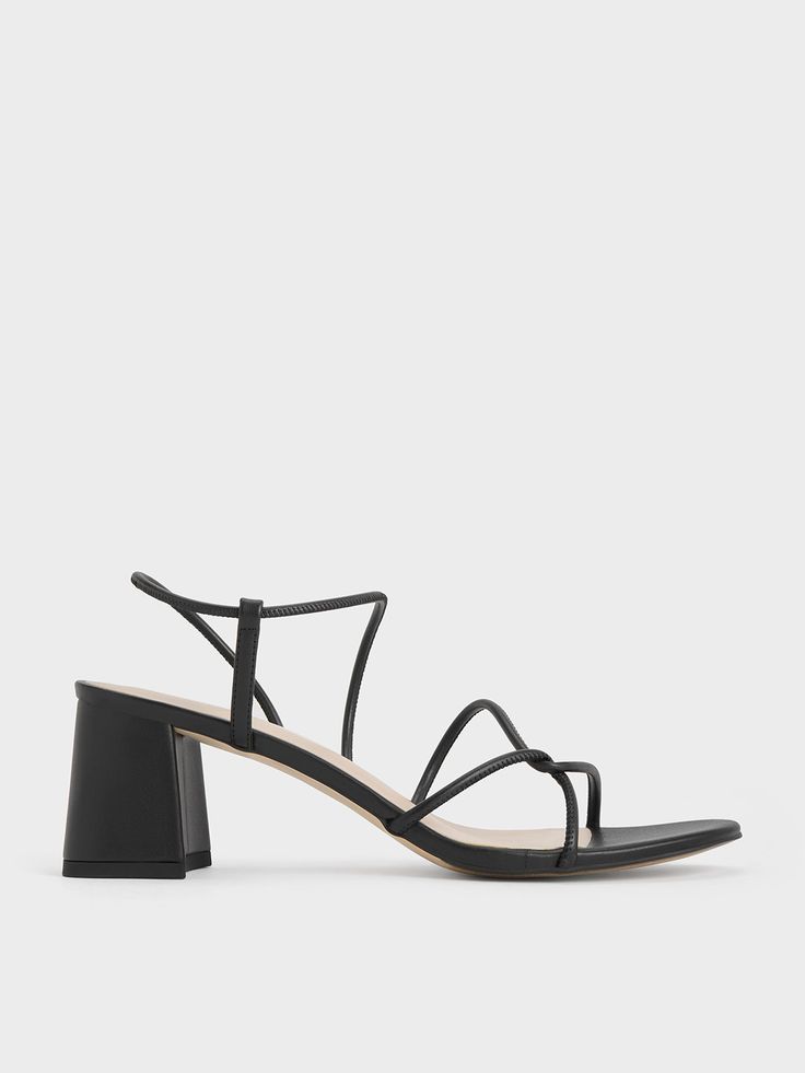 An elegant pair of strappy sandals looks good dressed up or down, and this pair of Meadow sandals will certainly get the job done. Featuring a distinctive interlaced design, these sandals feature swooping lines that create a flattering fit. With the polished versatility of the black finish and leg-lengthening lift of the block heels, they are the perfect pair for both dressy and casual occasions. Strappy Sandals With Wrapped Heel, Spring Sandals With Multiple Straps And Open Heel, Formal Sandals With Multiple Straps And High Heel, Formal High Heel Sandals With Multiple Straps, Formal Sandals With Multiple Ankle Straps, Formal Open Toe Heels With Multiple Straps, Chic Sandals With Straps And Block Heel, Chic Open Toe Sandals With Multiple Straps, Formal Strappy Sandals With Wrapped Heel