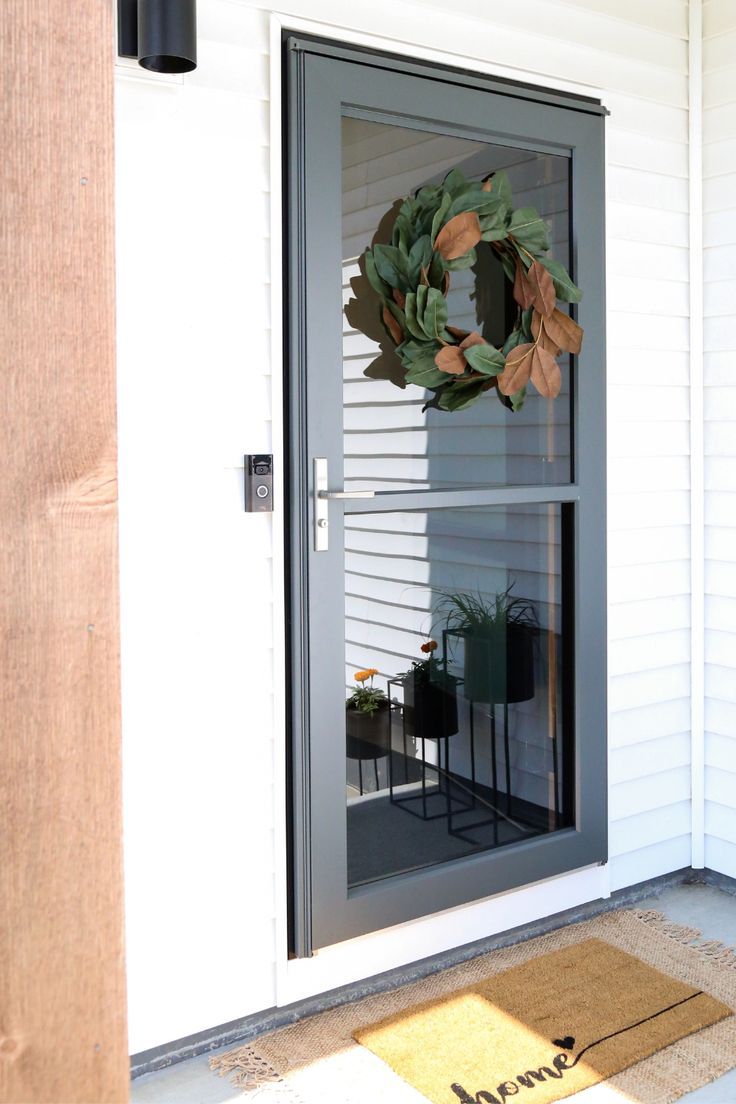 a door with a wreath hanging on it