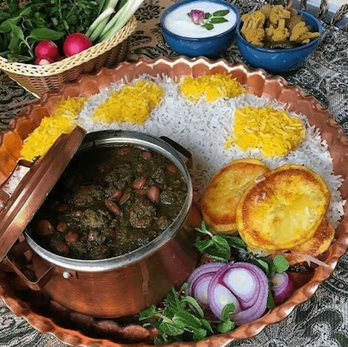 a bowl filled with rice and vegetables next to other foods on top of a table