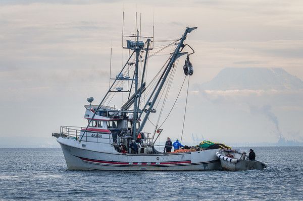 a boat with people on it in the water