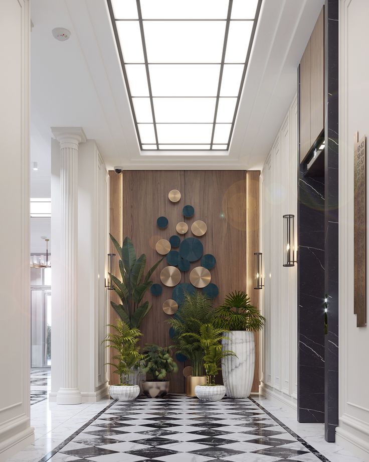 a hallway with black and white checkered flooring, potted plants and decorative wall art