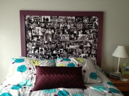 a bed with a headboard made out of pictures on the wall and pillows in front of it