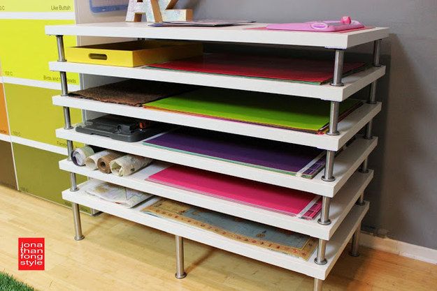 a shelf with many different colored folders on it