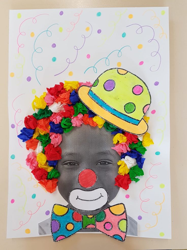 a child's clown face is made out of paper