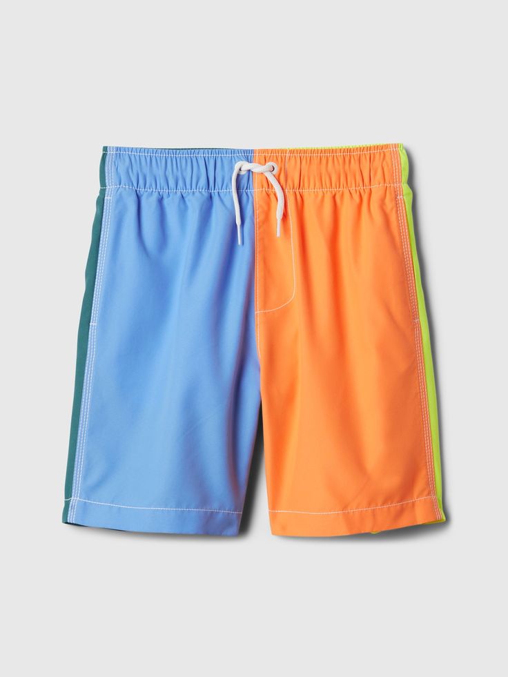 These swim trunks are made with 100% recycled polyester.  Using recycled materials helps to conserve resources and reduce waste.  Soft stretch woven knit swim trunks.  Elasticized waist with drawcords.  Front slant pockets, back patch pocket.  Certain styles have allover prints.  Please note: Our white style is a part of our Bailey Elder collection.  UPF 50+: Excellent UV Protection Accords with ASTM Standard D6603.  This product was made in a factory that invests in gender equality and women’s Playful Swim Trunks With Elastic Waistband For Poolside, Playful Blue Swim Trunks With Elastic Waistband, Playful Blue Swim Trunks For Summer Activities, Multicolor Color Block Bottoms For Poolside, Sporty Blue Swimwear For Summer, Playful Multicolor Swim Trunks For Swimming, Playful Multicolor Shorts For Pool, Gap Summer Swimwear For Beach Season, Gap Summer Swimwear