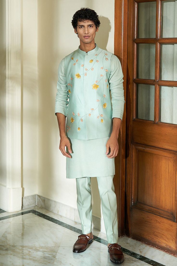 Blue bundi with floral hand painted motifs. Paired with kurta and pant.
Component: 3
Pattern: Hand Painted
Type Of Work: Floral
Neckline: Band
Sleeve Type: Long
Fabric: Pure Silk
Color: Blue
Other Details: 
Weight (in gm): 800
Floral motifs
Occasion: Wedding - Aza Fashions Stylish Men Wear, Floral Meadow, Kurta Men, Kurta Set For Men, Hand Painted Clothing, Men Stylish Dress, Nehru Jackets, Kurta With Pants, Fashion App