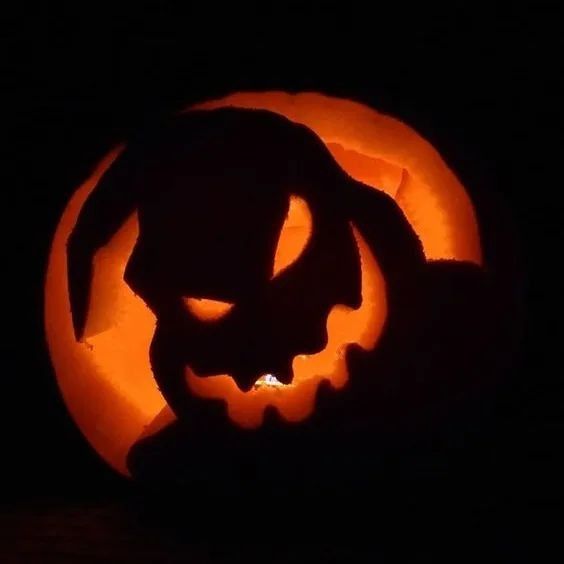 a pumpkin carved to look like a cat