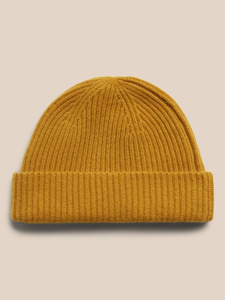 Inspired by fisherman's hats from the turn of the century, this luxuriously soft and warm cashmere beanie is designed in a shorter length so it sits higher up.  Ribbed knit design adds softness and a luxe texture.  Length: 9. 25" (23. 5cm) Classic Solid Beanie For Fall, Classic Solid Color Fall Beanie, Cashmere Soft Knit Beanie, Cozy Cashmere Beanie Hat, Casual Cashmere Soft Knit Hat, Classic Beanie Hats For Fall, Classic Beanie For Fall, Knitted Cashmere Beanie Hat, Classic Cashmere Soft Knit Hat