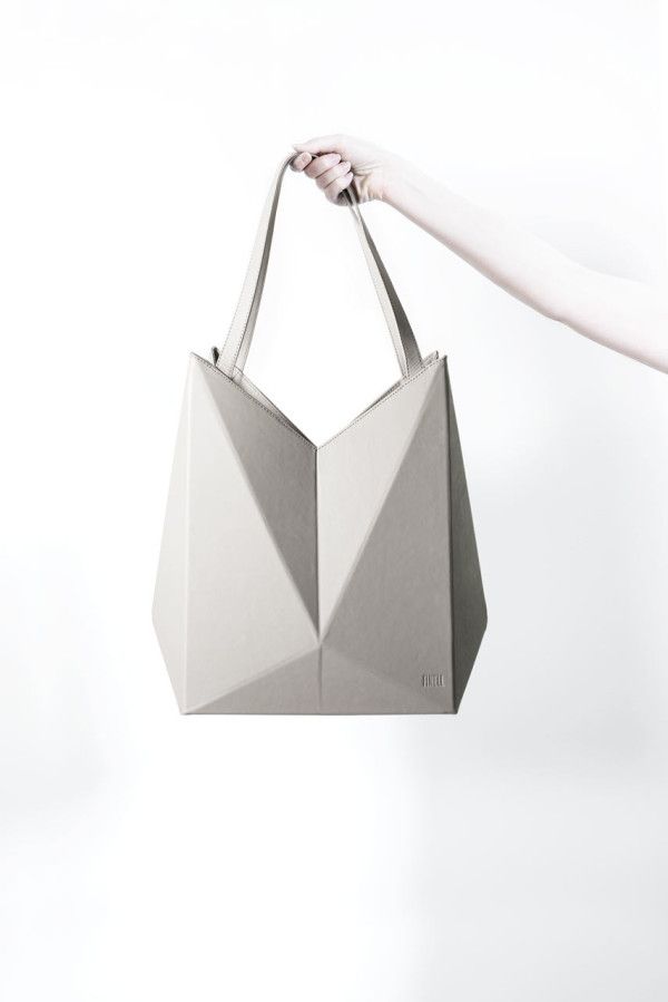 Lifestyle Brand FINELL Launches Debut Handbag Collection. These geometric bags take inspiration from origami with their faceted forms 3d Bag Design, Geometric Bag Design, Origami Product Design, Geometric Product Design, Futuristic Handbag, Origami Product, Origami Handbag, Origami Products, Geometric Products