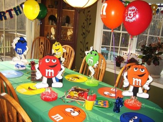 the table is set for an m and m themed birthday party