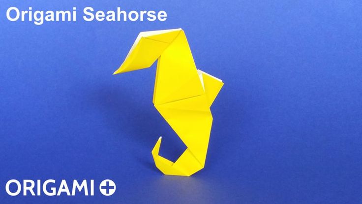 an origami seahorse on a blue background with the words origami