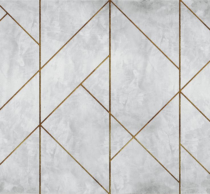 a white marble wall with gold lines on the bottom and sides in an abstract pattern