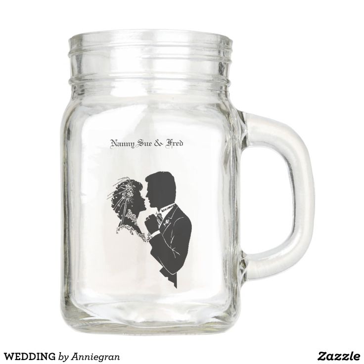 a glass jar with a wedding photo on it