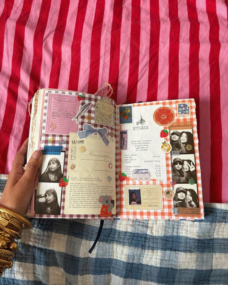 a person is holding an open book with pictures on it and the pages have been altered