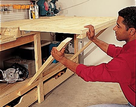 a man working on a wooden table in his workshop with the words, step 5 build the flip - assembly table