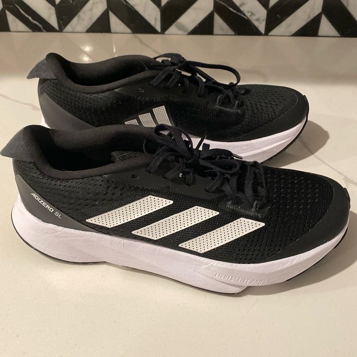 New Adidas Adizero Size 7 Women's Sneaker. New Without Tags. Black Athleisure Sneakers With Vented Sides, Black Sneakers With Vented Sides For Running, Adidas Sneakers For Marathon, Black Running Shoes With Vented Sides, Black Training Running Shoes With Vented Sides, Black Running Shoes With Vented Sides For Sports, Black Sneakers With Vented Sides For Errands, Adidas Black Running Shoes For Jogging, Low-top Running Shoes With Vented Sides