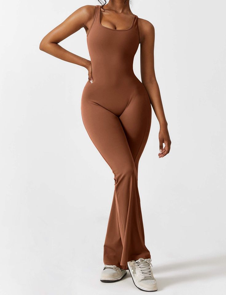 This jumpsuit is made of a durable and non-deforming fabric with a soft and moisture-wicking feel. It has a four-way stretch design that is comfortable and keeps you dry. The back has a stylish cutout that highlights the elegant butterfly bone structure. The deep V cut and scrunch at the hips enhance your silhouette. The flared shape elongates the legs and accentuates their curves. This jumpsuit is perfect for casual wear, sports, yoga, fitness, and various workouts.   Feature   Backless design Sleek Sleeveless High-stretch Jumpsuits And Rompers, Sleek Sleeveless Stretch Jumpsuits And Rompers, Elegant Sleeveless High Stretch Jumpsuits And Rompers, Sleek Stretch Summer Jumpsuits And Rompers, Fitted Backless Jumpsuit In Solid Color, Fitted Solid Color Backless Jumpsuits And Rompers, Sleek Stretch Jumpsuits And Rompers For Summer, Elegant Sleeveless High Stretch Jumpsuit, Chic Stretch One-piece Jumpsuits And Rompers