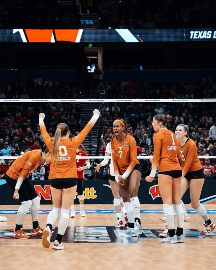 the volleyball team huddles together before their match