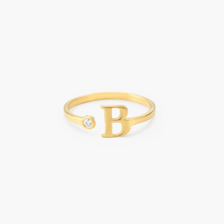 Size Guide  Safety PolicyCare InstructionsUp your stacking game with. This beautiful gold vermeil initial ring with cubic zirconia. It features an open design and a dainty crystal for that extra sparkle. Perfect for everyday or special occasions.Customize Me! Personalize this piece with 1 initial. Make It Yours: Opt for your first, middle, or last name initial to create a custom statement ring.How To Wear It: Style it with other rings to create a one-of-a-kind and trendy stack.Gold Vermeil: Gold Rings Trendy, Spiral Jewelry, Petite Jewelry, Gold Initial Ring, Simple Rings, Trendy Rings, Simple Silver Jewelry, Family Rings, Costume Jewelry Rings