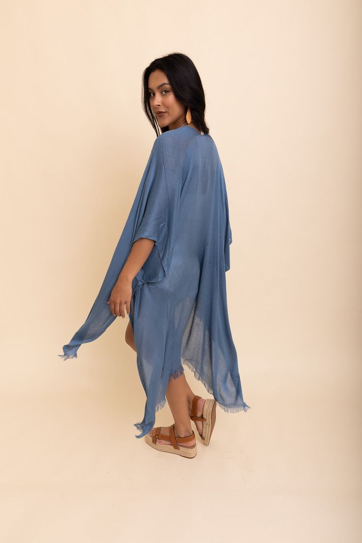 Flaunt your free-spirited style this summer with our Sun-kissed Breeze Frayed Trim Kimono! Perfect for vacations and weekend festivities, the kimono’s lightweight design is bound to keep you cool and comfortable. A layer of frayed trim along the borders adds an extra touch of texture and playfulness that is irresistible. The bright colors are bound to make you stand out so get ready to turn heads! Not only is it perfect for completing any beach-look, but also great to add a little extra flair to