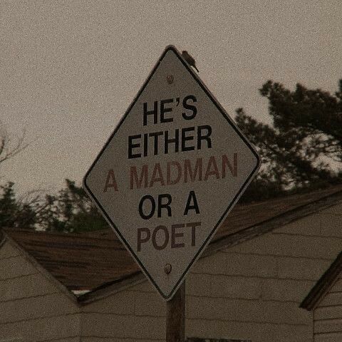 there is a sign that says he's either a madman or a post