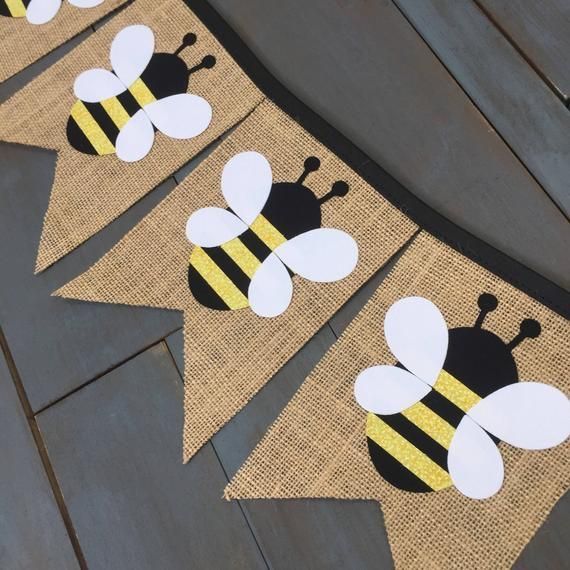 three burlap banners with bees on them