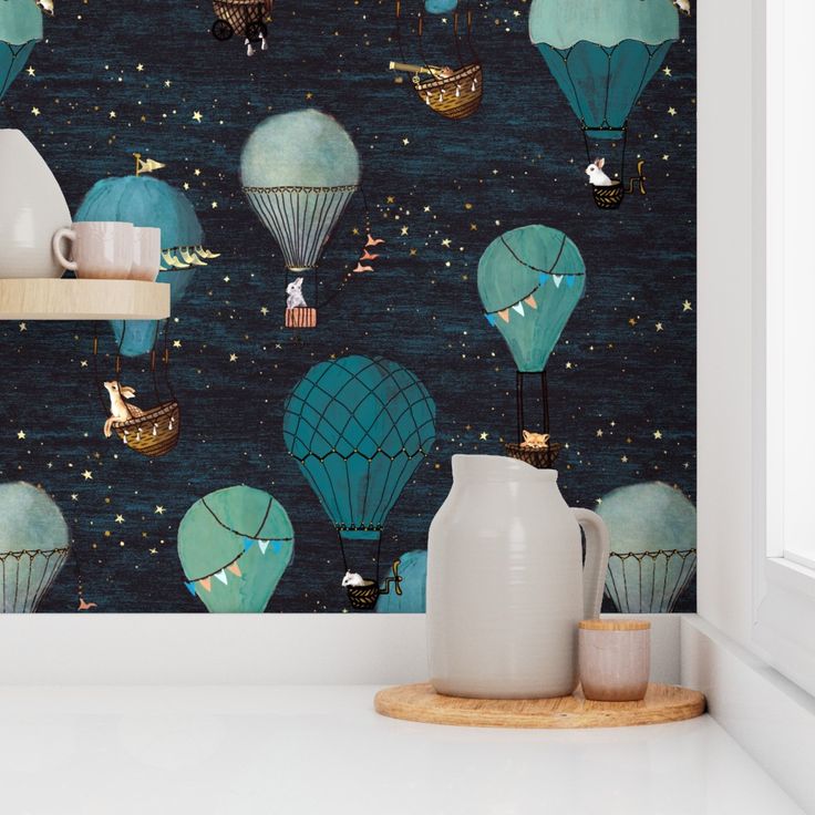 a wallpaper with hot air balloons in the sky and stars on it's side