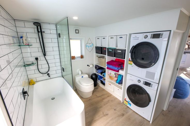 a washer and dryer in a small bathroom