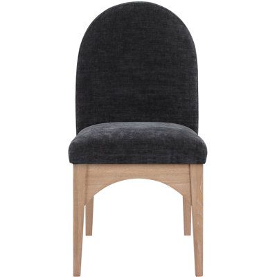 an upholstered chair with a wooden frame and dark grey fabric seat padding